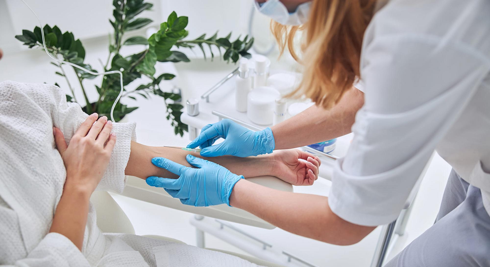 IV Therapy Essentials patient model smiling with her eyes closed